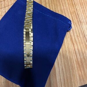 gold bracelet within crown on it. It is NOT a …. But your friends won’t know